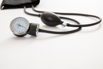 Medical sphygmomanometer on white background, closeup view.