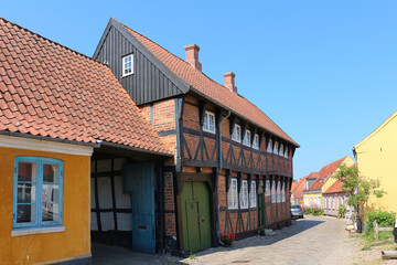 Fototapeta na wymiar Historic half-timbered house at cobblestone street in Ribe, Denmark