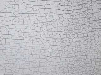 Cracked paint on white black wall