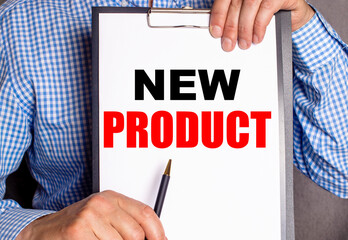 NEW PRODUCT written on white paper held by a man. Advertising concept