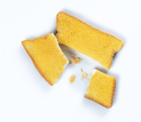 Baked crispy bread with butter and sugar on white background