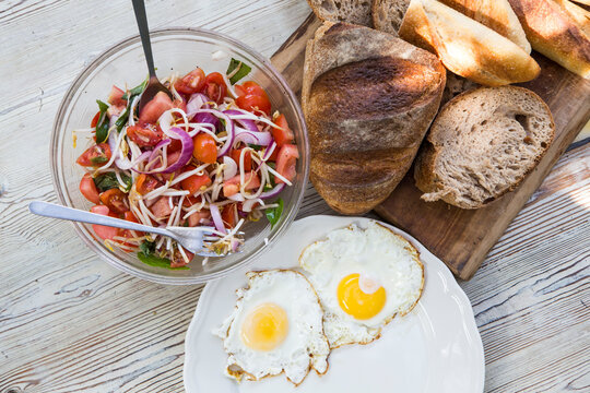 Fried eggs, bread and sald breakfast