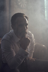 cinematic photo shoot of the confident actor celebrity look in foggy loft room