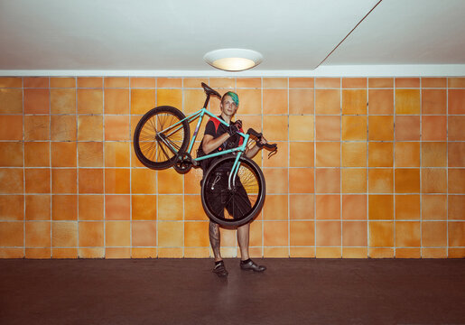 Bicycle Messenger Carrying His Bike