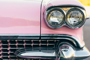 close up of antique pink and chrome car