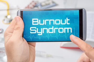 Smartphone mit dem Text Burnout Syndrom auf dem Display
