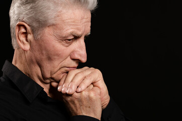 Close up portrait of thoughtful senior man