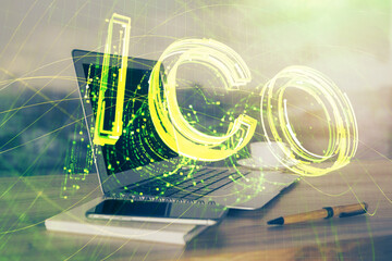 Double exposure of blockchain theme hologram and table with computer background. Concept of bitcoin...