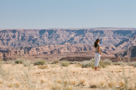 Woman taking in a scenic view of the distant Fish River canyon