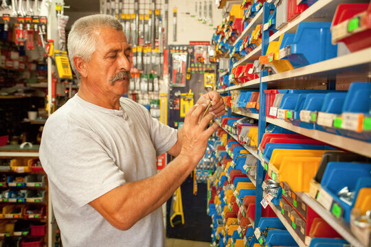 Old man in a tool store.