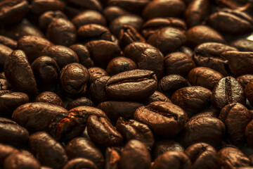 Roasted coffee beans background. international day of coffee. Close up. Selective focus
