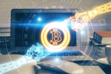 Multi exposure of blockchain theme hologram and table with computer background. Concept of bitcoin...