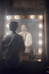 cinematic photo shoot of the confident actor celebrity look in foggy loft room