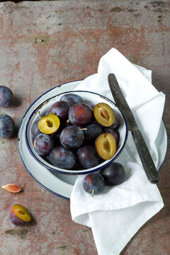 Plums in vintage bowl