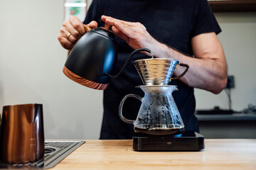 Barista preparing coffee with filter