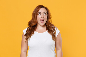 Excited young redhead plus size body positive female woman girl 20s in white blank design casual...