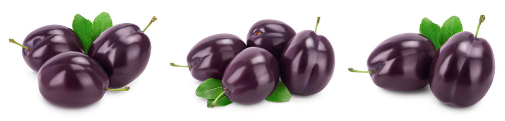 fresh purple plum and slices with leaves isolated on white background with clipping path and full depth of field. Set or collection