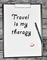 Travel is my therapy written on paper