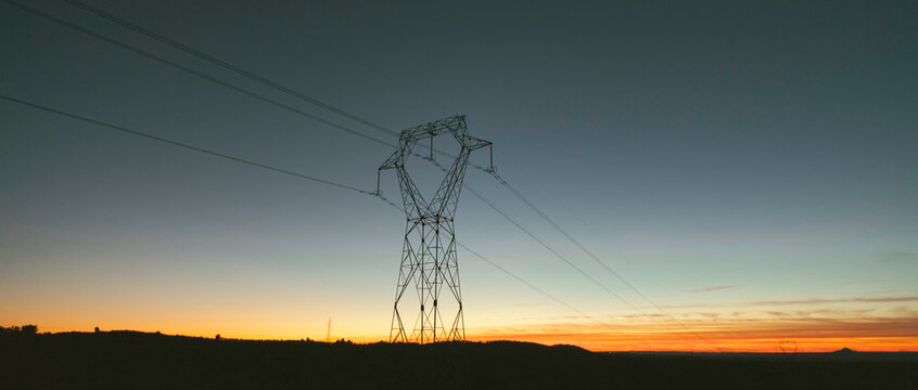 landscape with electric tower at sunset.