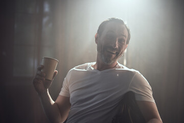 cinematic photo shoot of the confident actor celebrity look in foggy loft room