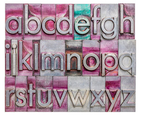 lowercase English alphabet  in vintage, gritty metal letterpress type stained by printing inks, rectangular composition isolated on white
