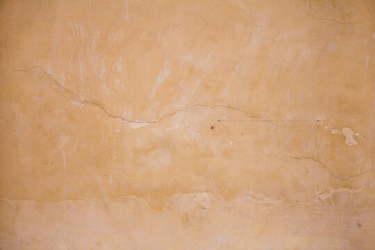 Cream color old wall background and texture with free space