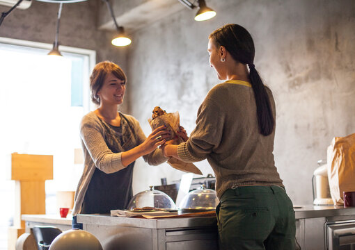 Woman Buying Bread