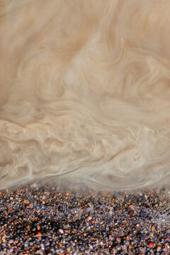 Texture picture of water mixing with sand.