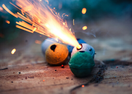 Colorful clay smoke bombs with sparks flying
