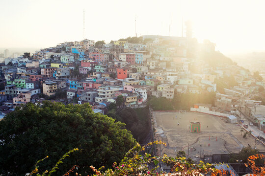 Colourful slums on a hill during sunset