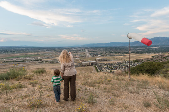 Grandmother Pointing Out Her Home From High Above The Valley