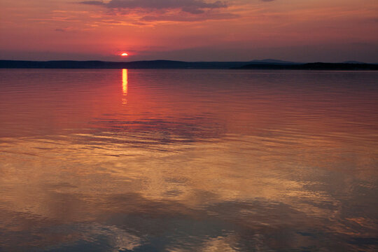 Colorful sky of sunset reflecting on a lake - Powered by Adobe