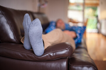 man relaxing on a sofa
