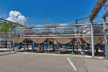 Naklejka premium Stainless steel reservoirs for wine at modern winery, Ukraine.