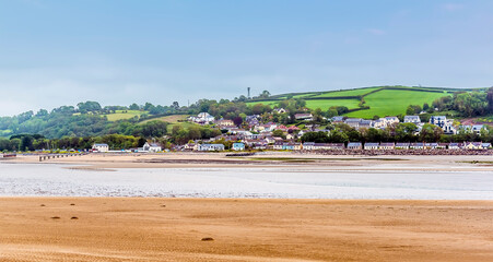 A view across the river Towy estuary at Llansteffan, Wales towards the coastal village of Ferryside in the summertime