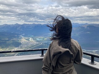 Girl with flowing hair and beautiful landscape