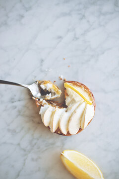fresh lemon meringe tart on a marble platter
