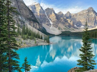 Beautiful blue lake with rocky mountains and trees