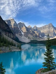 Beautiful blue lake with rocky mountains and trees