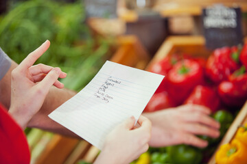 Market: Woman Holding Grocery List