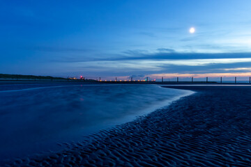 Blue hour on a beach on the Belgian coast on a summer night.