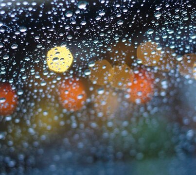 Droplets with lights in the background