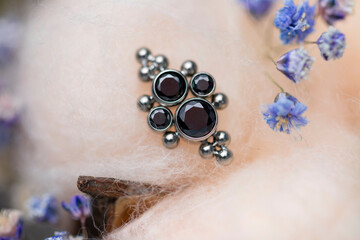 Beautiful piercing jewelry. Macro shot. Selective focus.