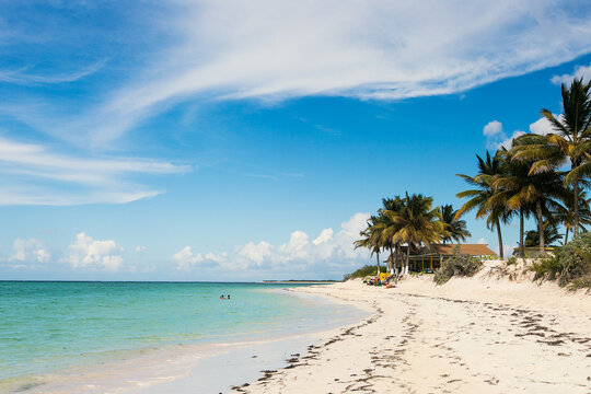 Bar on the beach with blue sky and white sand