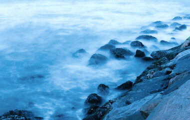floating rocks in beach. Long Exposure