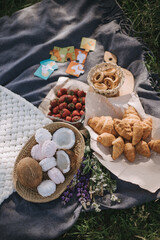 Picnic in the park with sweets and fruits