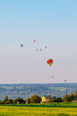Fototapeta premium Hot air balloons over the countryside in summer