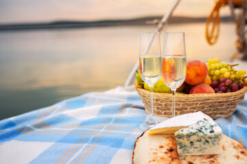 picnic on a yacht at sunset