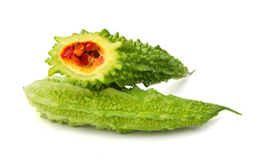 Bitter melon and slice on white background