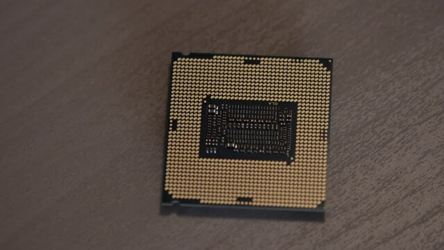 Cpu microprocessor closeup shot. Integrated microchip with hi-tech pattern. Pan Shot of printed microelectronic and microcircuit tech component